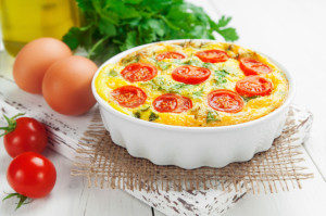 Omelet with vegetables and cheese. Frittata